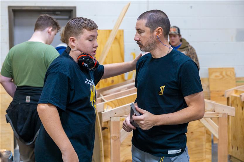 Students build doghouses